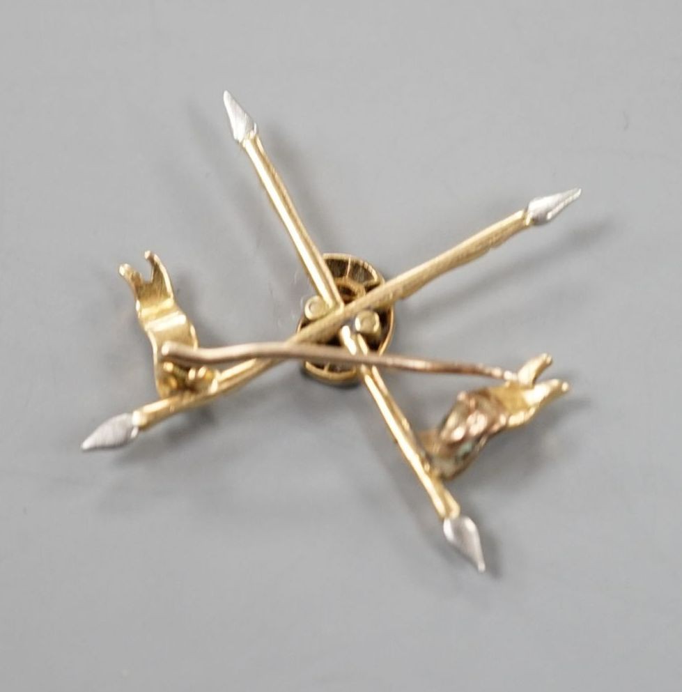 An early 20th century yellow and white metal two colour enamel and diamond chip set 9th Bengal lancers sweethearts brooch, width 29mm, gross weight 3 grams.